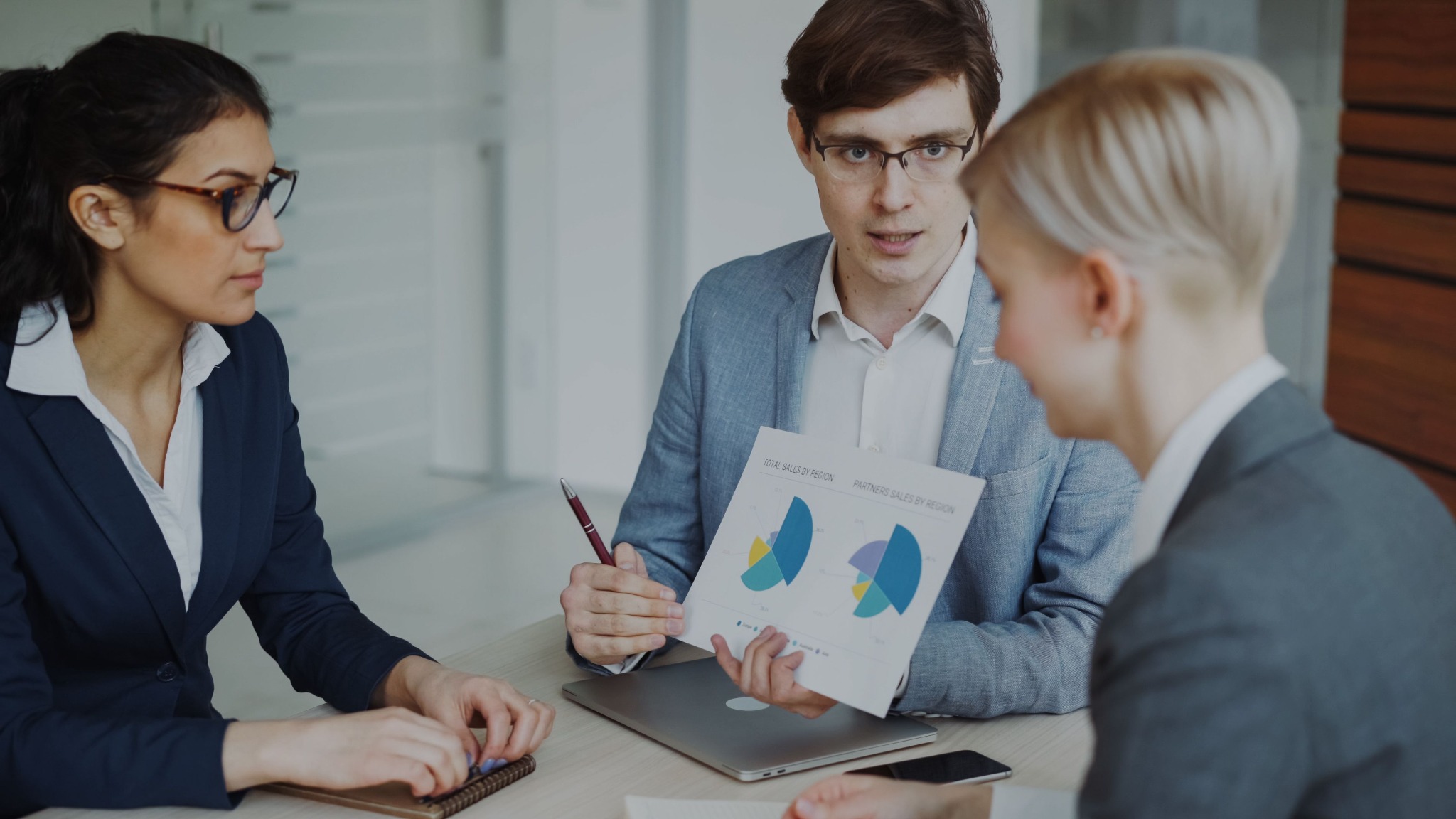 Sales team reviewing presentation material